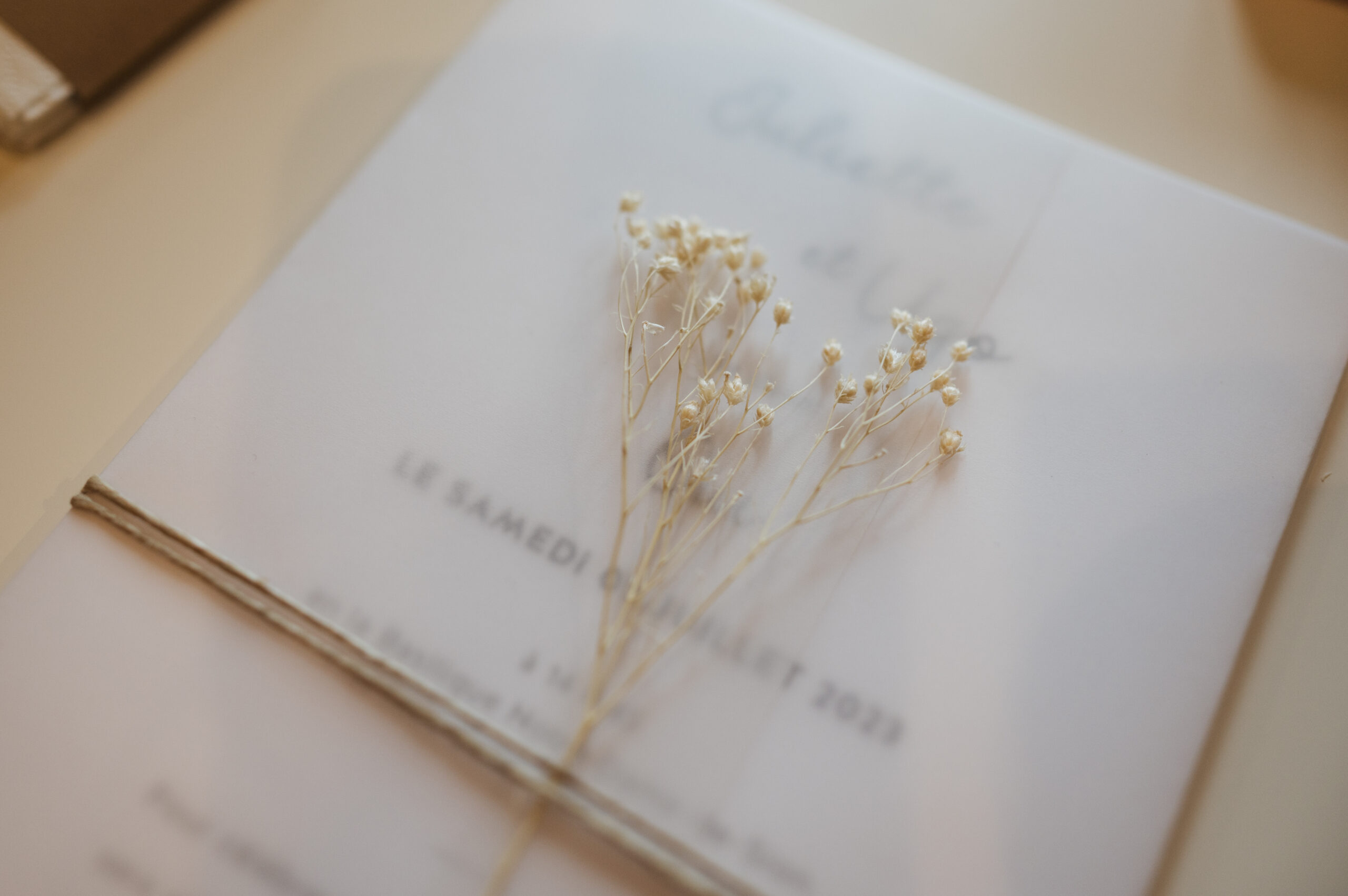 Wedding invitation details with dried flowers