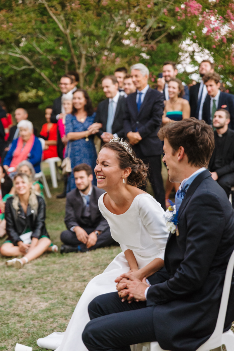 Bride laughing during an outdoor wedding ceremony